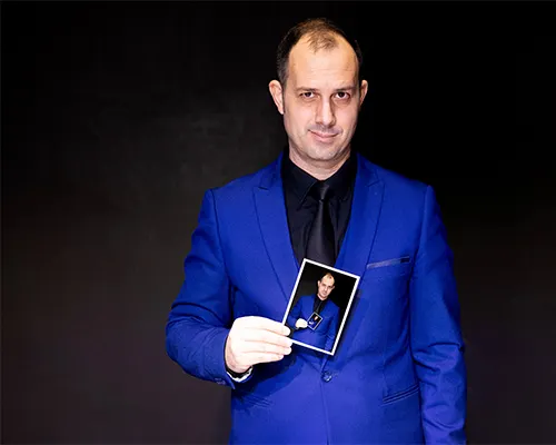 Bryan Miles Magician Holding Playing Card